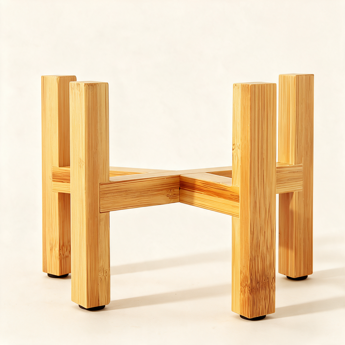 Natural bamboo four-post plant stand cradle for potted plants.