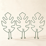 Set of three green leaf-shaped plant stem support hoops.