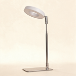 White ring grow light on a chrome telescoping stand.
